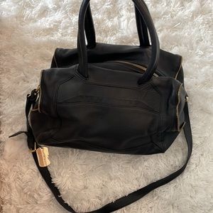 Vince Camuto bag with black 100% genuine leather and gold detail.